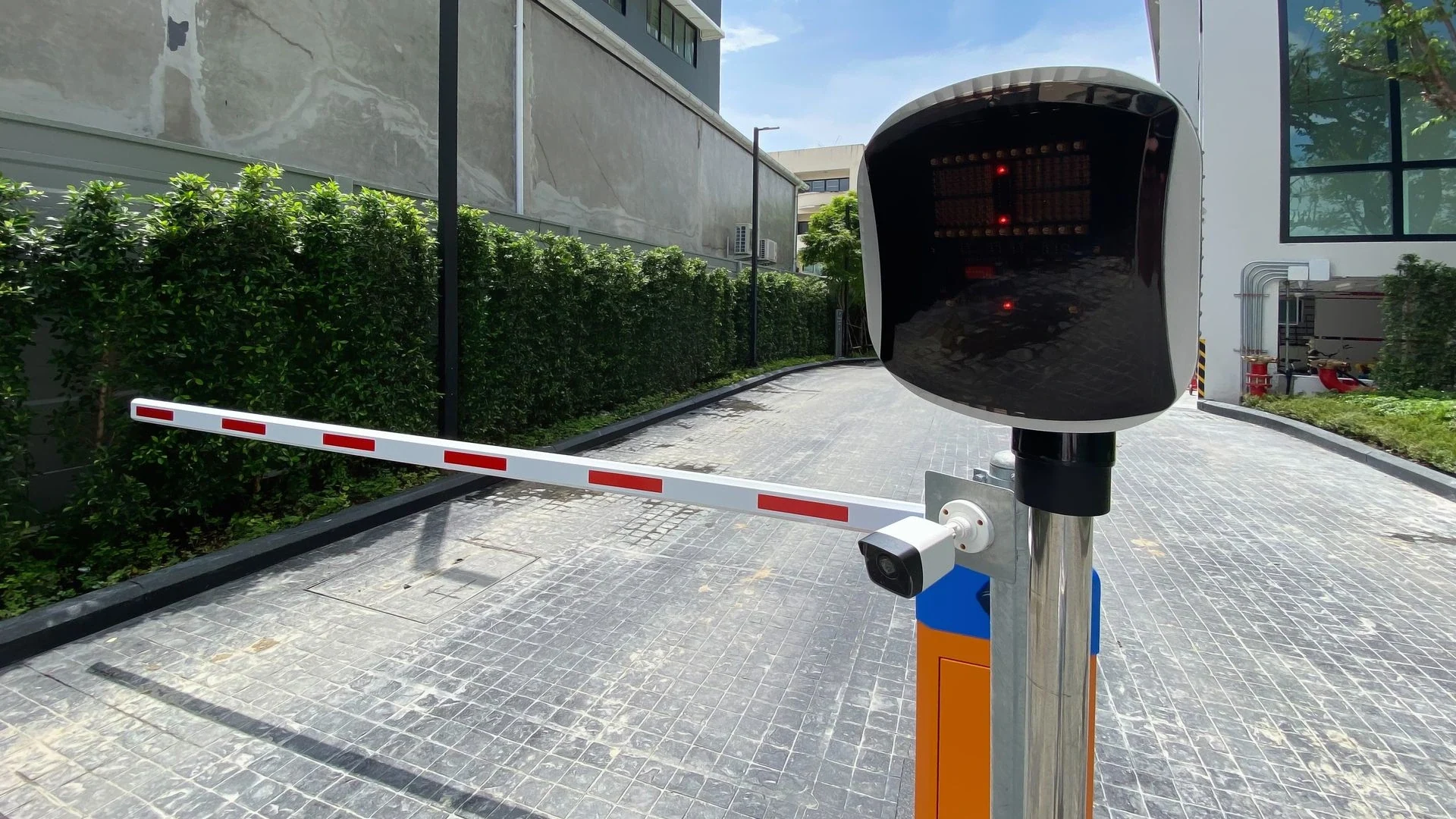 Road barrier arm and ANPR camera on a vehicle entrance lane in Dubai